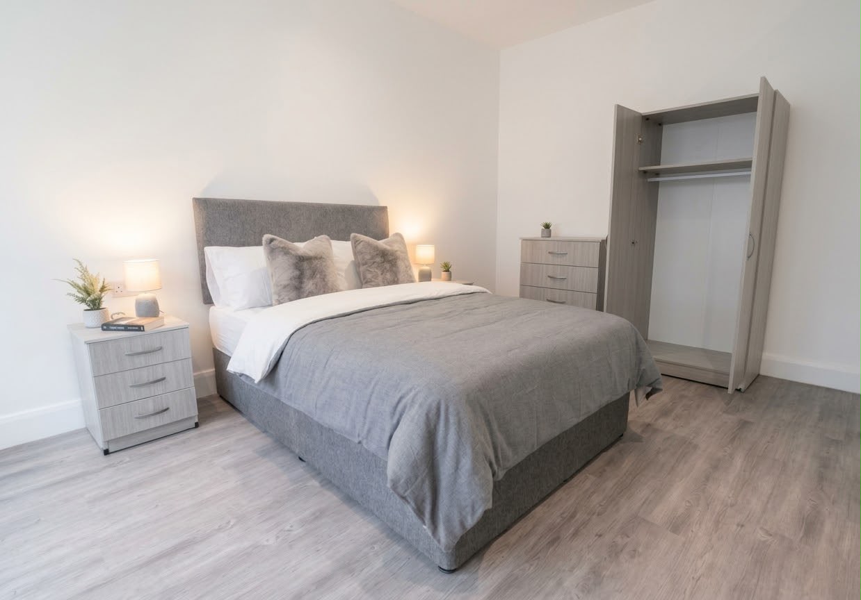 GBA Furniture furnished bedroom with upholstered bed, bedside drawers, chest of drawers and wardrobe